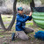in use photo of a person utilizing their lightweight insulated pullover to stay warm while they set up their under quilt