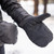 in use photo of a person utilizing their lightweight insulated mitts to stay warm in cold weather