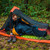 the photo has a man in an orange and black tent getting into a quilt (the conundrum) that is Navy and orange.